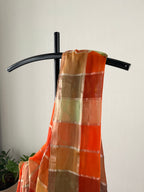 Sm-028 madras check mul cotton in the shades of orange and green